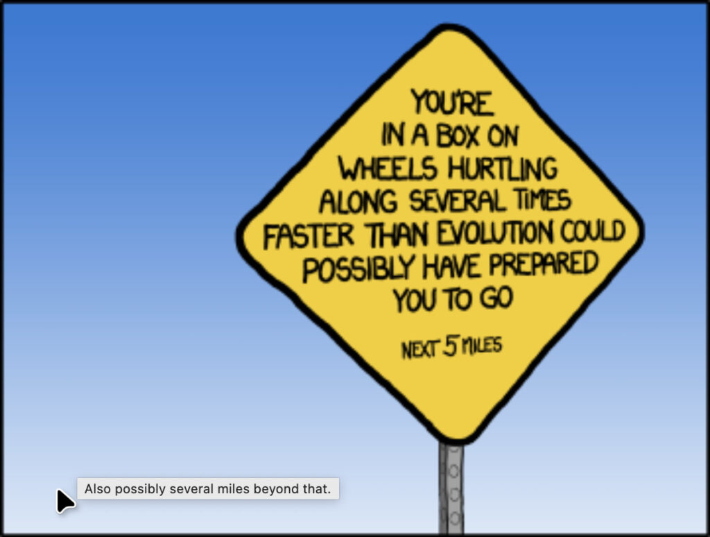 Image of traffic sign labeled 'You're in a box on wheels hurtling along several times faster than evolution could possibly have prepared you to go'